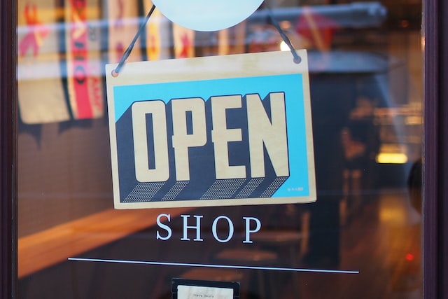 an open sign of a small business - using a small business loan to open a store or business